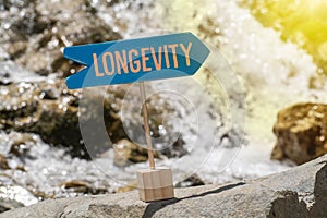 Longevity sign board on rock