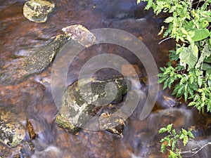 Longexposure photography of the stream of a river V