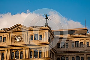 The building of Lonja del Comercio, stock exchange, now the offices of foreign companies. Topped with a statue of mercury, the God photo