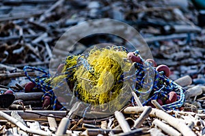 Longline Fishing Gear Thrown on the Beach. Yellow Skein with Bamboo Sticks and Other Trash By the Sea