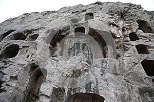 This is the Longmen Grottoes in Luoyang, Henan Province, China, a famous tourist attraction. photo