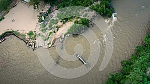 Longneck karen village in the mountain with boat on the river. Mae Hong Son, Thailand. Aerial shot