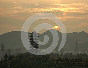 Longquan Pagoda at sunrise on a cloudy day photo