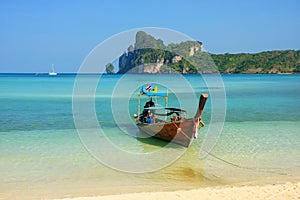 Longtail boat anchored at Ao Loh Dalum beach on Phi Phi Don Island, Krabi Province, Thailand photo