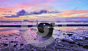 Longtail boat on the beach of Lipe island at dawn