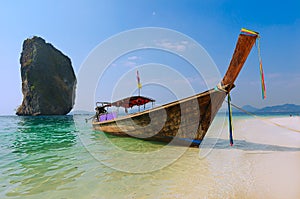 Longtail boat on beach in Thailand