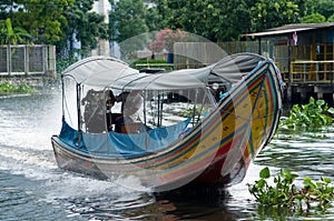 Longtail boat on a canal in Bangkok, Thailand