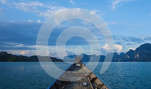 Longtail boat on the lake at Ratchaprapha dam, Khao Sok National Park, Thailand