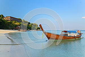 Longtail boat at mountain beach