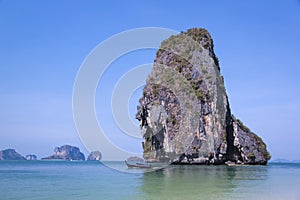 Longtail boat passing koh poda from railay beach krabi