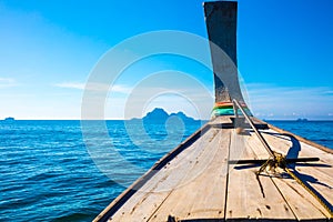 Longtail Boat In Sea At Aonang Beach Against Blue Sky