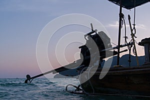 Longtail boat at sunset