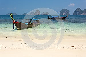 Longtail boat on tropical shore