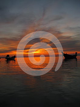 Longtail boats sunset thailand