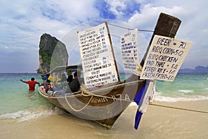 Longtailboat selling snacks at the beach