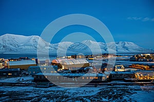 Longyearbyen industrial halls and hotels in the polar night noon