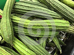 Loofash squash for sale at the fresh produce section of a grocery