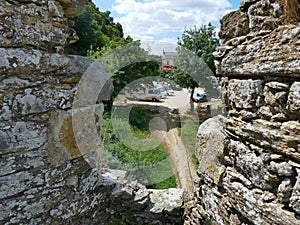 Look through the arched toll bridge le Cul du Moulin at the Loir