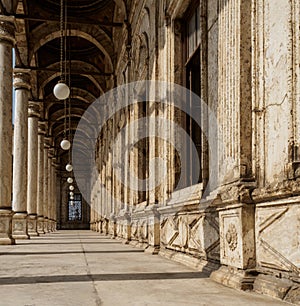 A typical arabic colonnade, portico or peristyle of a mosque in cairo