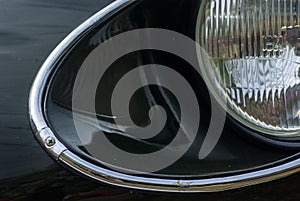 Look at bonnet and headlights with chrome ring of an oldtimer Jaguar ET type V 12 Coupe Series III during a rally