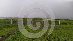 A look into the distance. Rainy weather in the field and cloudy skies