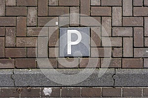 Look down empty parking spot with vegetation and shrubbery from above