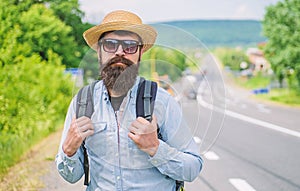 Look for fellow travelers. Tips of experienced backpacker. Man bearded hipster backpacker at edge of highway. Pick me up