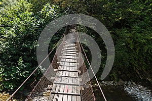 Look at the hanging bridge over the river