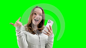 Look Here. Happy Woman Showing Blank Smartphone Screen and Pointing On It, white Background