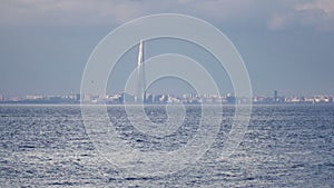 Look on Lakhta Center through the Gulf of Finland in summer sunny day