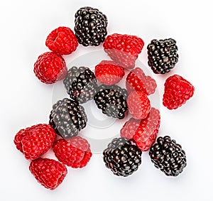 They look like artificial treats! But they are delicious and beautiful blackberries and fresh raspberries.
