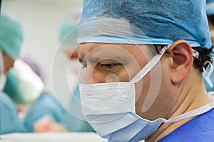 Look of male surgeon in operation room