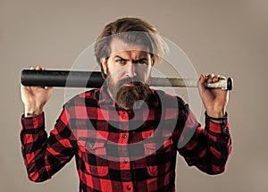 look menacing. brutal bearded man using baseball bat for fighting. man swung the bat. bandit gang and conflict. sport