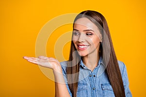 Look new advertisement. Portrait of positive cheerful girl promoter hold hand demonstrate ads promo sales discount wear