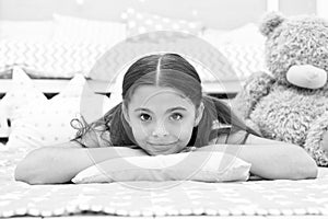 Look of perfection. Little girl with cute look. Beauty look of skincare model. Small child relax on bed in nursery