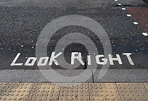 Look right written on tarmac road. Political metaphor maybe.