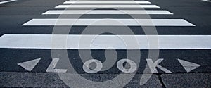 Look text with zebra crossing path on a road