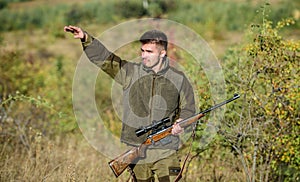 Look there. Noticed game. Man brutal unshaved gamekeeper nature background. Hunting permit. Hunting brutal masculine