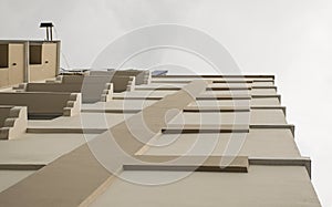 Look up at apartment housing in Thailand. Step of building.