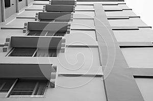 Look up at apartment housing in Thailand. Step of building.