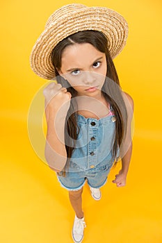 Look very serious. beauty. long-awaited summer vacation. happy childhood. serious little girl wear straw hat. beach