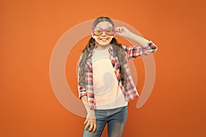 Look well and feel beautiful. Adorable girl with fashionable look on orange background. Little child having geeky look