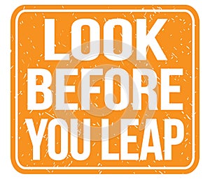 LOOK BEFORE YOU LEAP, text written on orange stamp sign