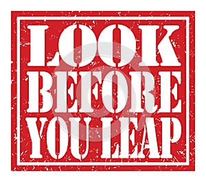 LOOK BEFORE YOU LEAP, text written on red stamp sign