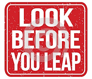 LOOK BEFORE YOU LEAP, text written on red stamp sign