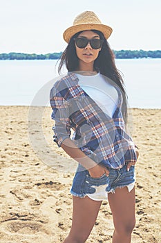 Lookin good. an attractive young woman enjoying a day on the beach.