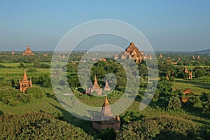 The late evening light catches the red bricks of the Dhammayan Gyi Temple on the plains of Bagan, in Myanmar