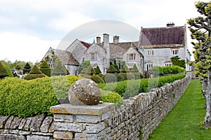 Looking across the formal gardens at an historic country house in Somerset, England