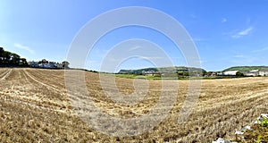 Looking across hay fields towards Port Erin, Isle of Man