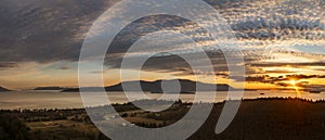 Panoramic sunset aerial view of Orcas Island seen from Lummi Island, Washington. photo